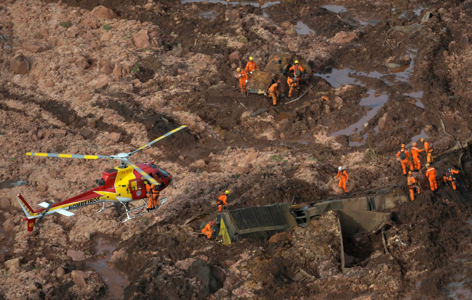 Rescue crew work in a dam owned by Brazilian miner Vale SA that burst, in Brumadinho