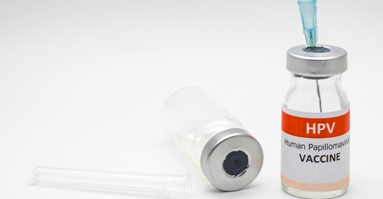 human papillomavirus ,HPV vaccine with needle on white background ,for
